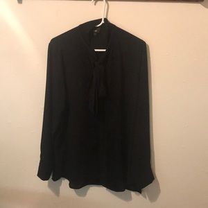 Long sleeve button up shirt with a tie neck